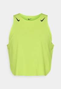 Grøn ærmeløs tanktop lavet af et let stof med sorte Nike-logoer på skuldrene og en afslappet pasform.