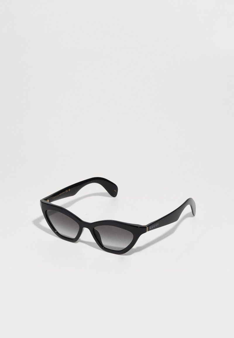 Mustad musta kaar silhouettesega prillid, millel on halli gradientläbipaistvused, valmistatud plastikust. Prillidel on kuldne bränding tempel ning sile ja läikega viimistlus.