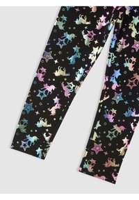 Leggings neri con un motivo multicolore e luccicante di unicorni e stelle. Il design include diverse dimensioni e orientamenti, creando un aspetto giocoso.