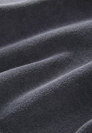 Dark gray textured fabric with a soft, plush surface, showing subtle ripples and a uniform pattern throughout.