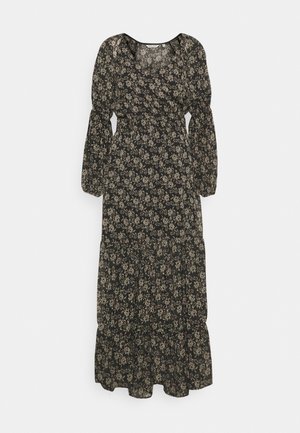 Schwarz langärmliges Midikleid mit beigem Blumenmuster, geraffter Taille, Puffärmeln und gestuftem Rock, das vor weißem Hintergrund hängt.