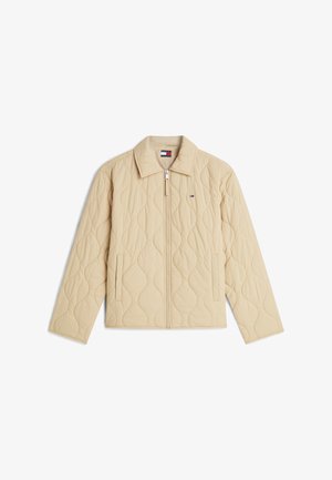 Chaqueta beige acolchada con cremallera completa en la parte delantera, dos bolsillos laterales y pequeño logo de Tommy Hilfiger en el pecho izquierdo.
