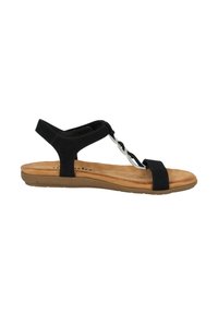 Sandalo in suede nero con design a T, caratterizzato da un accento intrecciato in argento e una soletta imbottita color beige. Suola in gomma piatta per il massimo comfort.