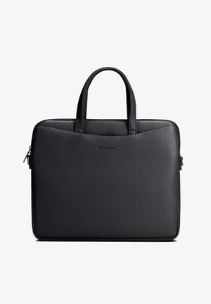 Zwarte leren aktetas met dubbele handvatten, ritssluiting en 'WITTCHEN'-logo in het midden voorop gegraveerd.