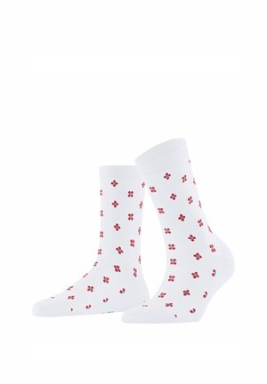 Chaussettes blanches mi-mollet avec un motif répétitif de petites fleurs à quatre pétales rouges et bleues sur un fond blanc uni.