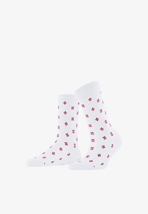 Chaussettes blanches mi-mollet avec un motif répétitif de petites fleurs à quatre pétales rouges et bleues sur un fond blanc uni.