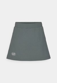 Gray skirt with an elastic waistband, featuring a logo patch on the lower side and a flared, simple design. Made from lightweight material.