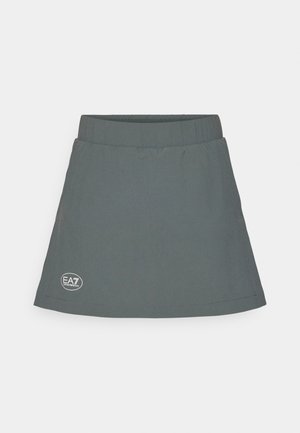 Harmahame, jossa on joustava vyötärö, alareunassa logo-patch ja kellotettu, yksinkertainen muotoilu. Valmistettu kevyestä materiaalista.