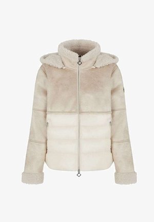 Beige huppari, jossa on vetoketju edessä, tikattu alaosa ja pehmeä fleece yläosa sekä hihansuut.