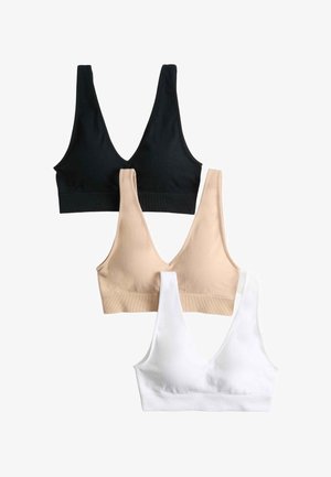 Tre sømløse V-hals bralette i sort, beige og hvid arrangeret lodret på en hvid baggrund.
