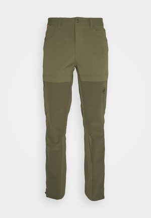 Pantalon d'extérieur convertible couleur vert olive avec jambes amovibles zippées, poches avant, passants pour ceinture et renforts au niveau des genoux.