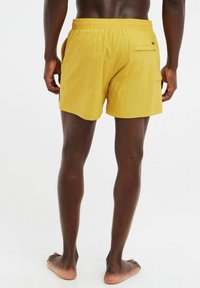 Protest YESSINE - Uimashortsit - tumericyellow