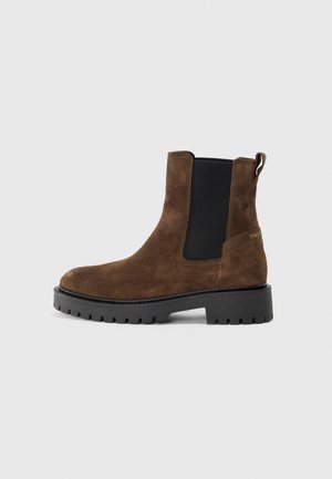 Brown suede ankle boot with elastic side panels, rounded toe, and a textured rubber sole. Features a pull tab on the back for easy wear.