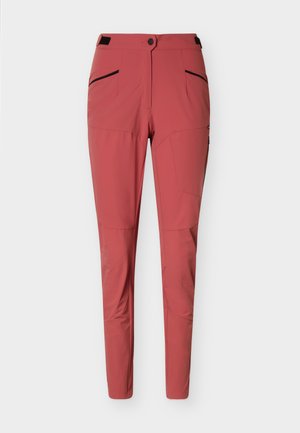Oprijete hlače barve rje z gumbom spredaj, zadrgo in žepi ob strani z črnim robom, zasnovane za aktivno nošenje.