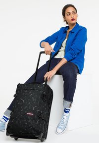 Eastpak TRANVERZ S x WHERE'S WALLY - Wheeled suitcase - blocks black