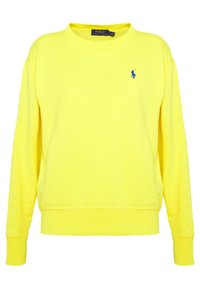 Žlutá bavlněná mikina s dlouhými rukávy, kulatým výstřihem a žebrovanými manžetami. Na hrudi je malý modrý vyšívaný logo.