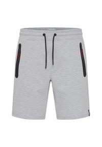 Shorts gris en matériau doux, avec des poches à fermeture éclair noires et des cordons de serrage noirs. Design simple avec une finition texturée.