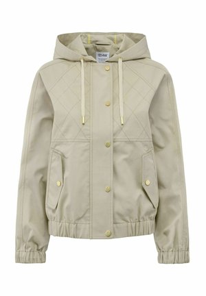 Jasno beżowa kurtka z kapturem, pikowana, z guzikami w kolorze złota, elastycznymi mankietami i dwiema bocznymi kieszeniami. Gładka faktura materiału.