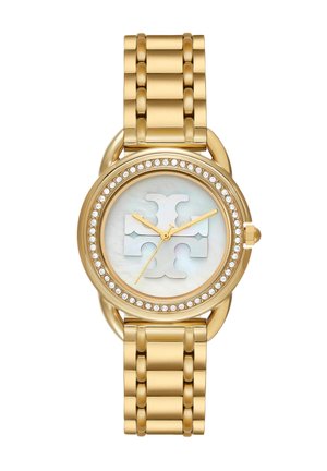 Gold wristwatch with round face, crystal-studded bezel, mother-of-pearl dial, and large stylized logo at center, linked metal band.