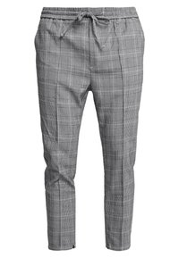 Pantalones de cuadros grises hechos de una tela ligera, con una cinturilla elástica con cordón y perneras ajustadas.
