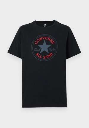 T-shirt en coton noir avec un motif circulaire en rouge et bleu affichant les textes "Converse" et "All Star" ainsi qu'une étoile au centre.