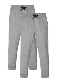 Graue Sweatpants aus einem weichen Baumwollmix, mit einem gerippten Bund und schwarzem Kordelzug, elastischen Bündchen und seitlichen Taschen.