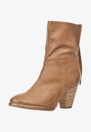Brown leather ankle boot with a tapered toe and a stacked heel. Features a folded cuff detail and vertical ridges on the heel.