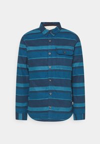 Camicia button-up a maniche lunghe in diverse tonalità di blu, con righe orizzontali, una tasca sul petto e orlo arrotondato. Tessuto strutturato.