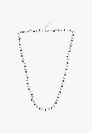 Collana in argento con perline nere distribuite uniformemente lungo la lunghezza, dotata di chiusura e catena di estensione per una vestibilità regolabile.