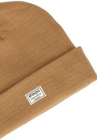 Chapeau en tricot marron avec un revers replié, arborant une étiquette blanche avec le texte "ZIGZAG ACTIVE LIFESTYLE" et un tissu texturé.