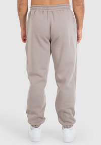 Graue, Sweatpants mit elastischem Bund und gerippten Bündchen, aus weichem Stoff gefertigt. Bieten eine lässige Passform und ein minimalistisches Design, ideal für Freizeitkleidung.