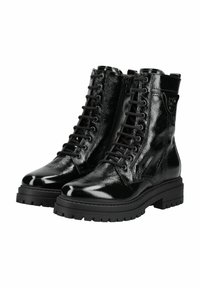 Bottines noires en cuir à lacets avec une finition brillante, bout rond, semelle épaisse et coutures décoratives sur les côtés.