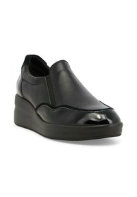 Scarpa nera in pelle slip-on con finitura liscia, suola a zeppa e pannelli laterali elasticizzati. Presenta dettagli lucidi e texture.