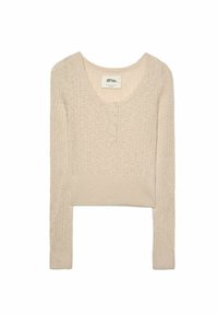 Haut long à manches courtes couleur beige clair, avec une texture côtelée et un col rond. Présente une patte de boutonnage à cinq boutons à l'avant et des poignets ajustés.