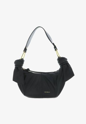 Sac à main en cuir noir avec côtés noués, quincaillerie dorée, sangle courte et petit logo doré "Coccinelle" sur le devant.