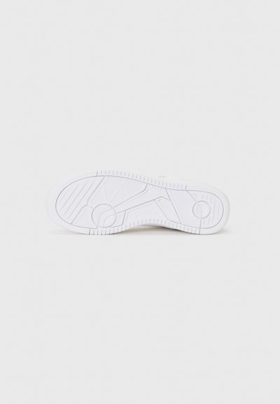 White sneaker sole with textured tread, featuring geometric patterns and logo detail. Smooth and rubbery material, designed for grip.