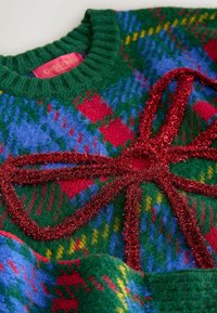 Unselected, green tartan tinsel bow