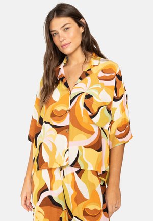 Short-sleeve button-up shirt in multicolored abstract pattern with orange, yellow, and green hues; lightweight fabric with a relaxed fit.