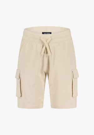 Shorts cargo beige en coton avec une taille élastique et un cordon de serrage. Ils comportent deux poches latérales avec rabats et une texture lisse.
