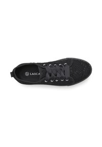 Black sneaker with woven upper texture, flat black laces, silver eyelets, and a textured sole. Logo printed inside on a black insole.