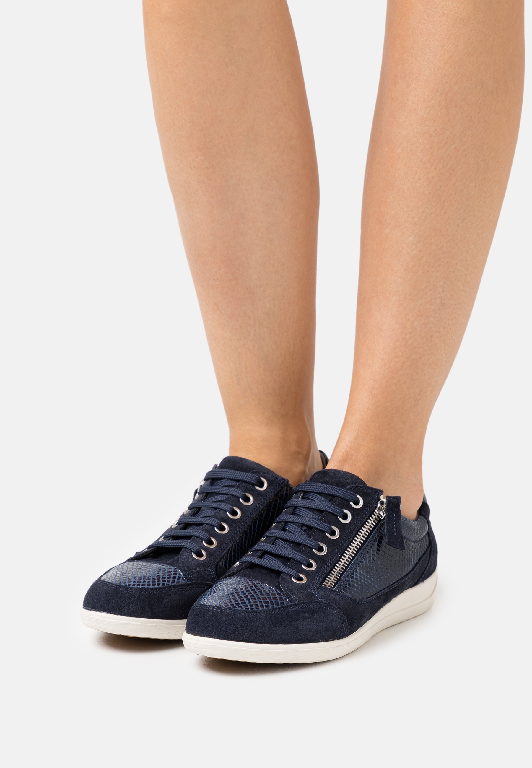 black nike revolution trainers