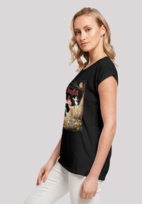 Juodas trumpas rankovėmis marškinėliai su retro „Bambi“ grafikos spauda spalvotai, stiliaus laisvai prigludę ir su suktomis rankovėmis.