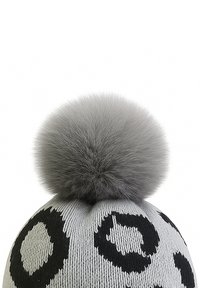 Gray knitted beanie featuring black leopard spots and a large gray faux fur pom-pom atop. Smooth texture with a fitted shape.