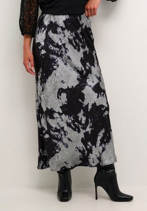 Jupe maxi noire et argentée avec un motif abstrait. Fabriquée en tissu léger, elle présente un design fluide et une taille confortable.