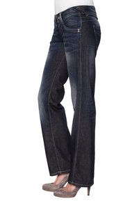 Mörkblå denimjeans med rak passform, med kontrastsömmar och en medelhög midja. Klassisk femficksdesign.