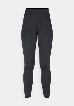 Høytlivs sorte leggings laget av elastisk materiale, med en glatt tekstur og tettsittende design, med minimale sømdetaljer.