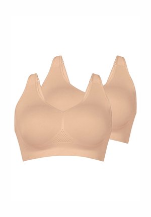 Due reggiseni wireless beige senza cuciture con spalline larghe e finitura liscia, progettati per comfort e sostegno.