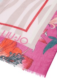 Bufanda multicolor con patrones florales en naranja y azul verdoso sobre un fondo rosa, con un diseño con borde en beige y acentos rojos.