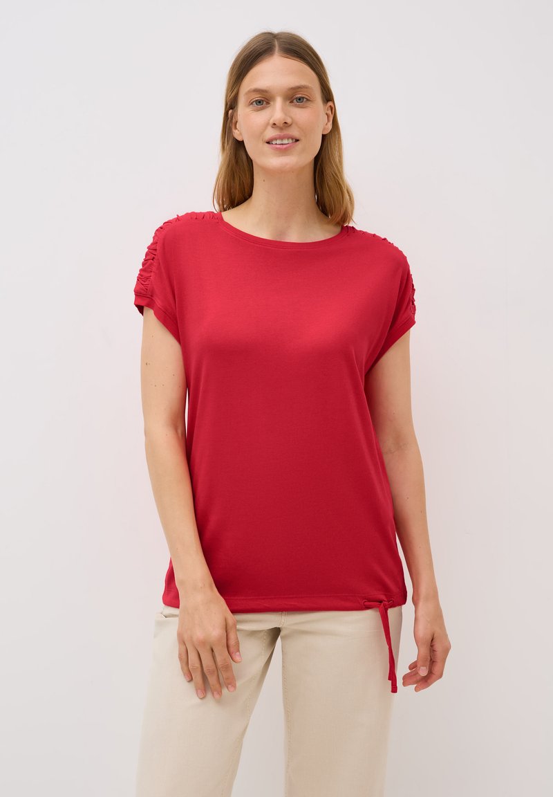 T-shirt rouge à manches courtes avec détail froncé aux épaules, un col rond et un lien réglable à l'ourlet.