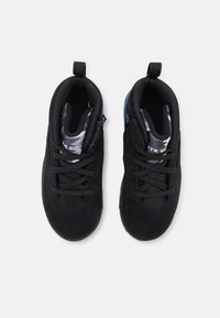 Black athletic shoes with a suede upper, lace-up design, textured black lining, and blue accents on the sole.